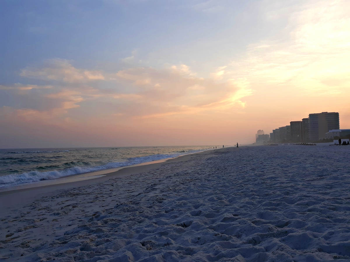 A wide photo of Orange Beach Alabama at Sunset.